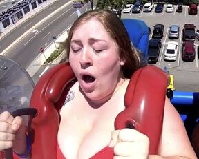 Huge cleavage on a theme park ride