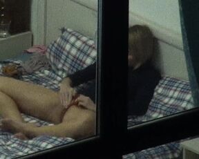 Hot girl masturbates on bed, window voyeur